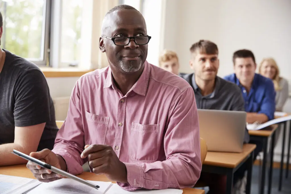 Man in class with tablet